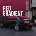 A black BMW coupe in a red gradient window tint parked outdoors on a paved street beside a modern building, with a large red-to-purple gradient graphic and the words 'RED GRADIENT' overlaid on the upper left.
